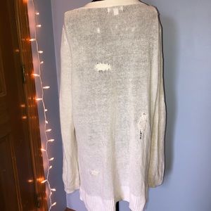 white Gap sweater with patches on the back